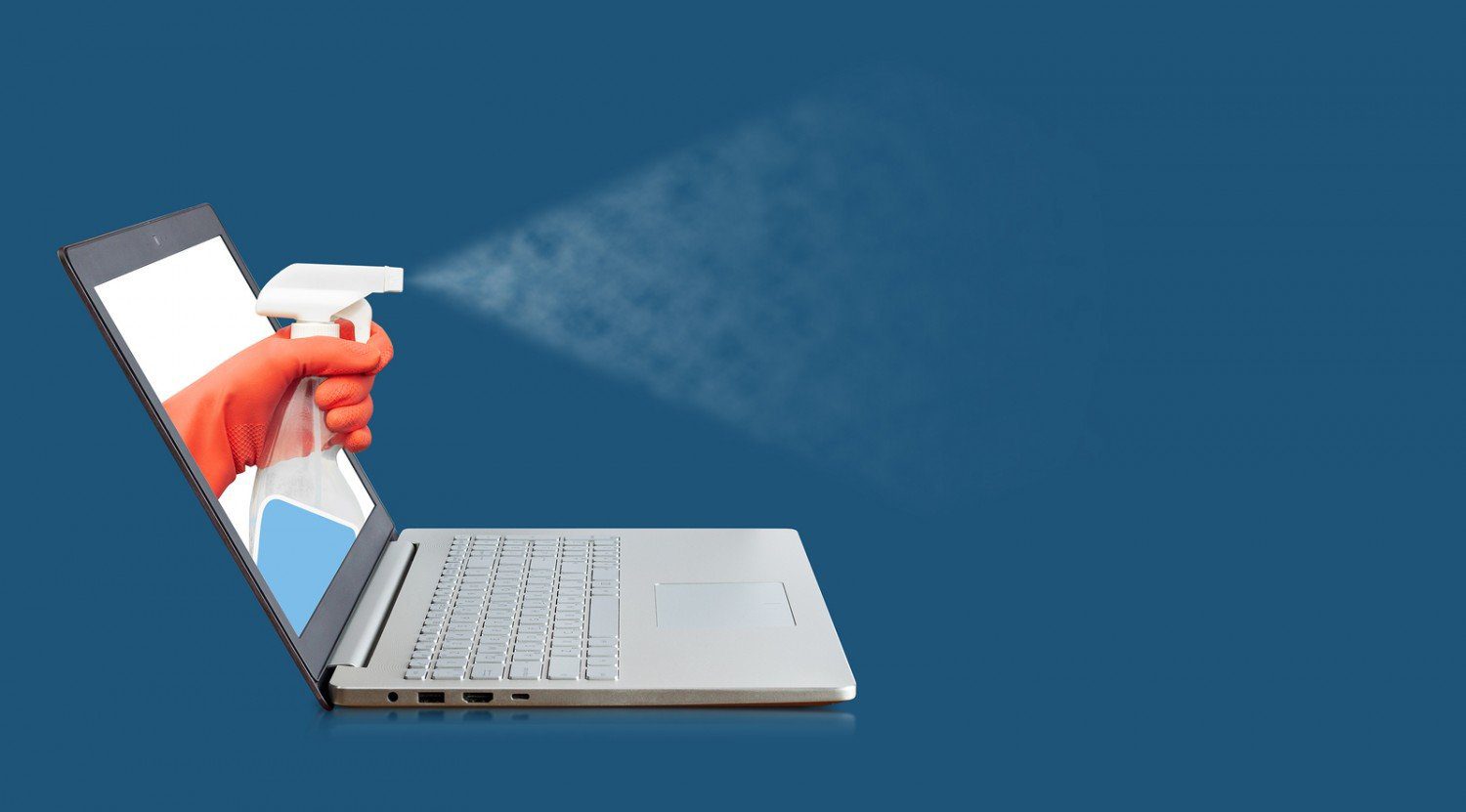laptop with person spraying cleaning product out of the screen