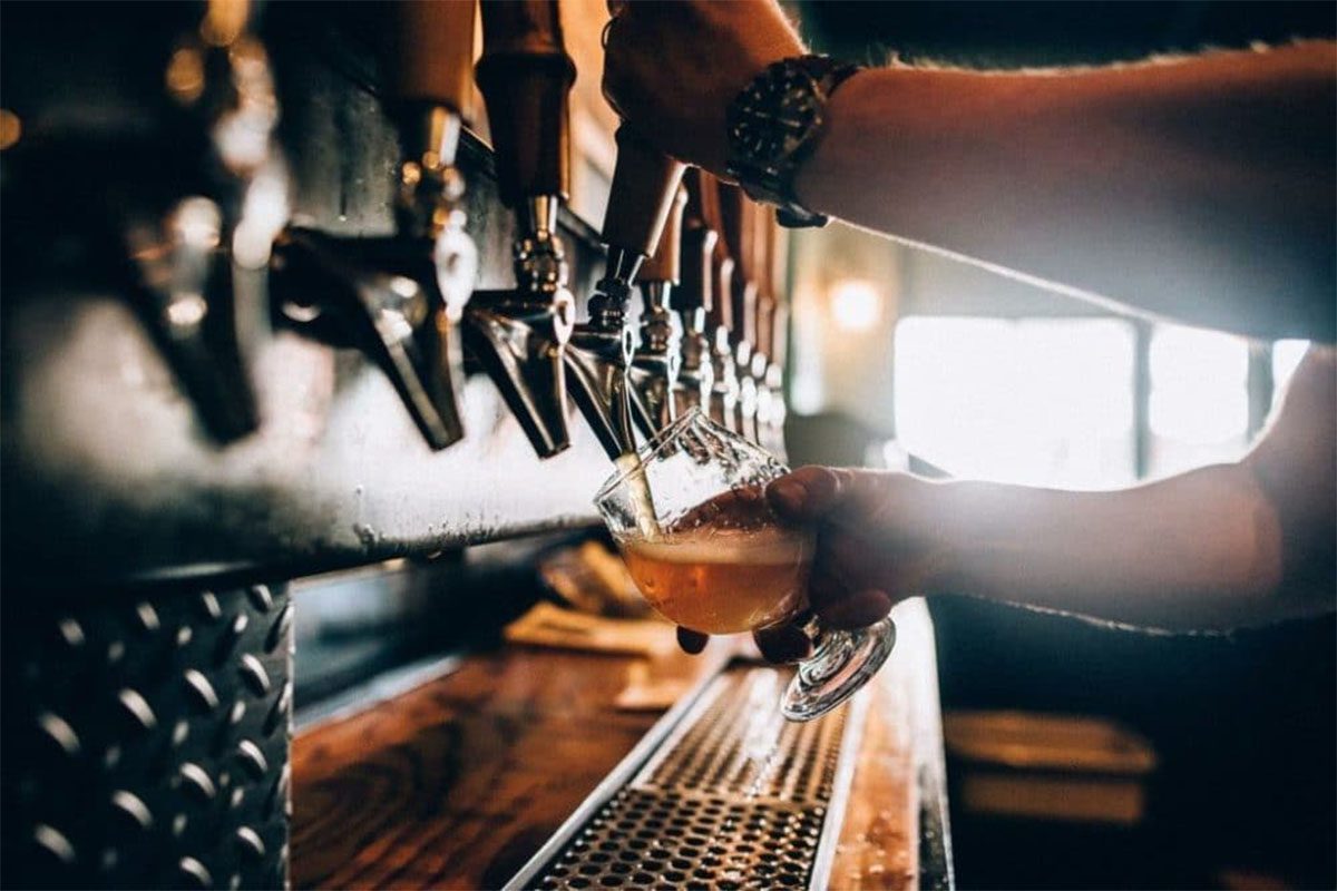 Photo of someone pouring beer at Medusa Brewery in Hudson MA