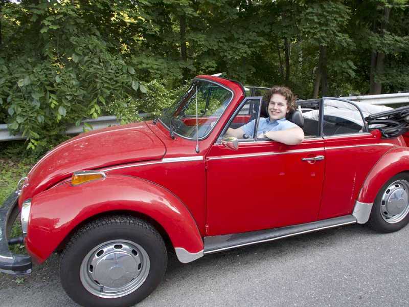 Mickey driving the company vehicle.