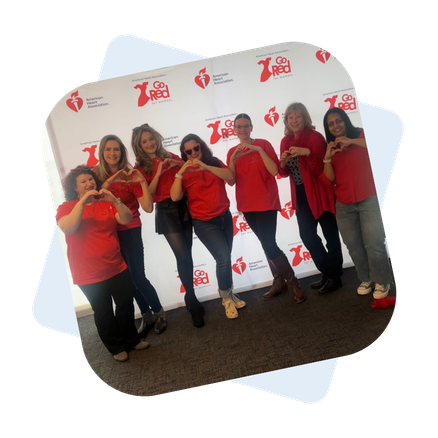 Ladybugz team members and community pose together at the GO RED Luncheon in Worcester MA.