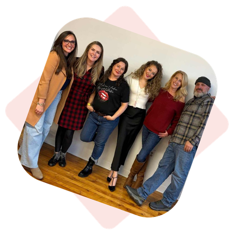 Ladybugz Interactive Team in a brick office.