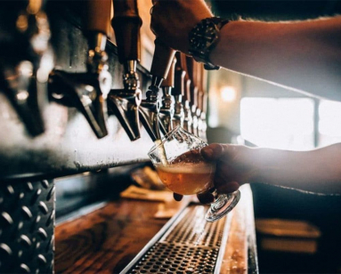 Photo of someone pouring beer at Medusa Brewery in Hudson MA