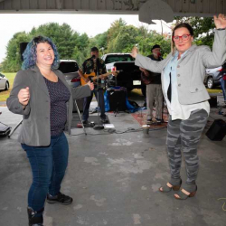 Lysa & Billie dancing to a band.