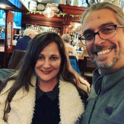 Lysa & Jon smiling in a selfie at an event